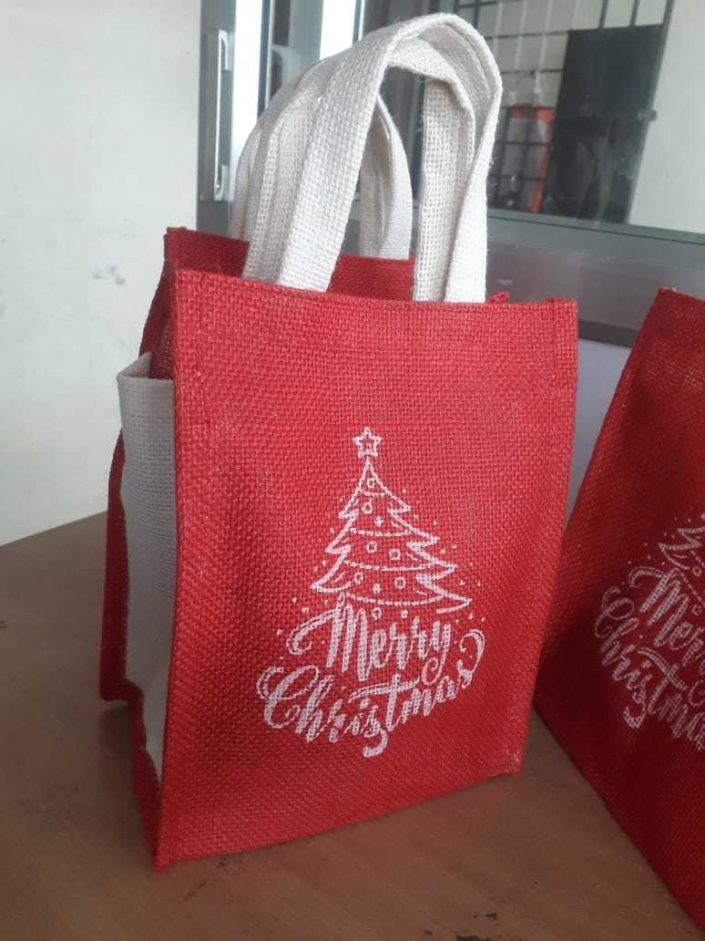 Christmas Jute Carry Bags - 9 X 7 X 5 Inches | Eco-friendly Material, Red And White Color, Customizable Design With Hand Length Handle