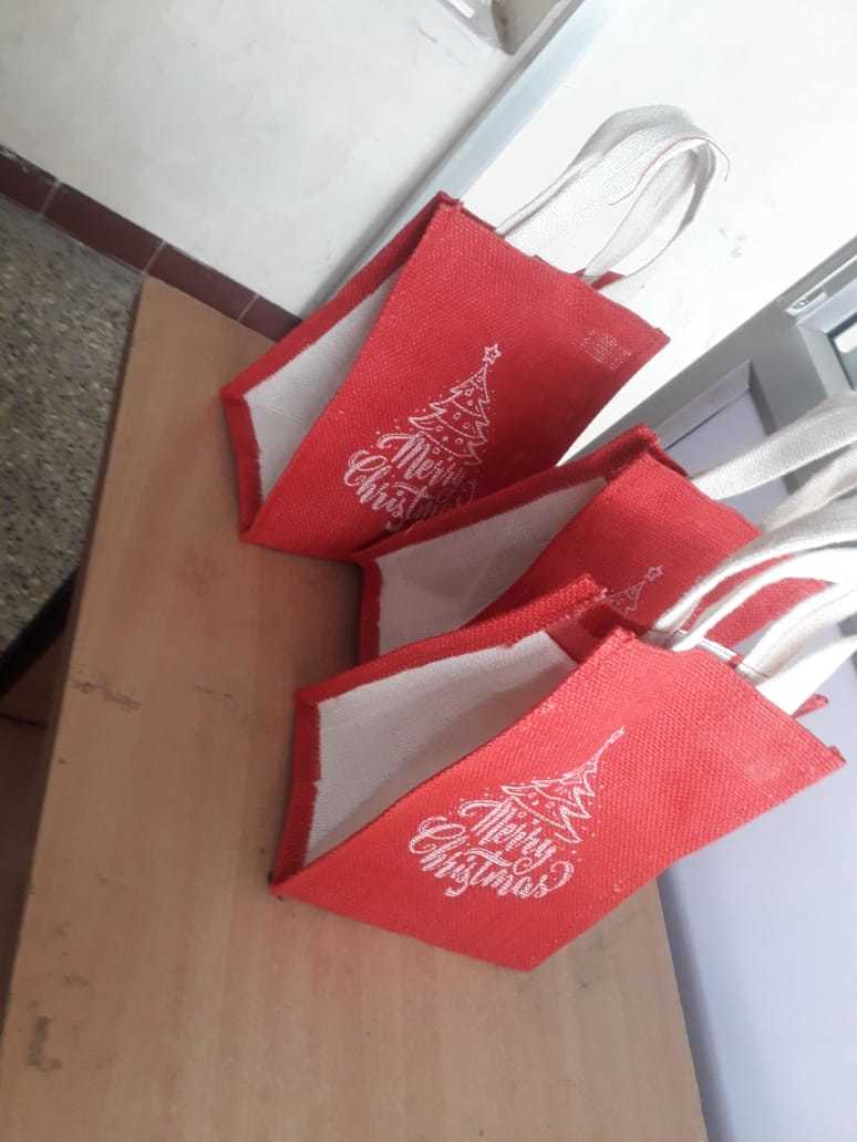 Christmas Jute Carry Bags - 9 X 7 X 5 Inches | Eco-friendly Material, Red And White Color, Customizable Design With Hand Length Handle