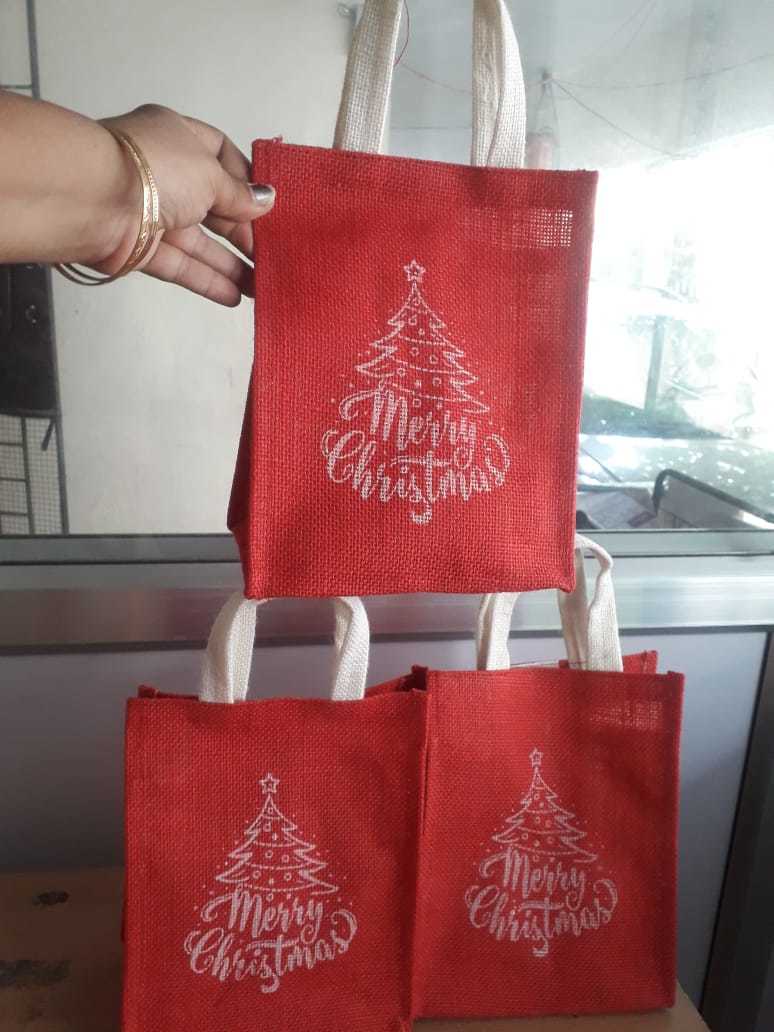 Christmas Jute Carry Bags - 9 X 7 X 5 Inches | Eco-friendly Material, Red And White Color, Customizable Design With Hand Length Handle