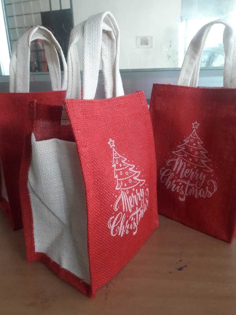 Christmas Jute Carry Bags - 9 X 7 X 5 Inches | Eco-friendly Material, Red And White Color, Customizable Design With Hand Length Handle
