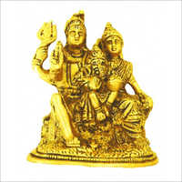 पीतल की सुनहरी शिव पार्वती गणेश प्रतिमा के साथ