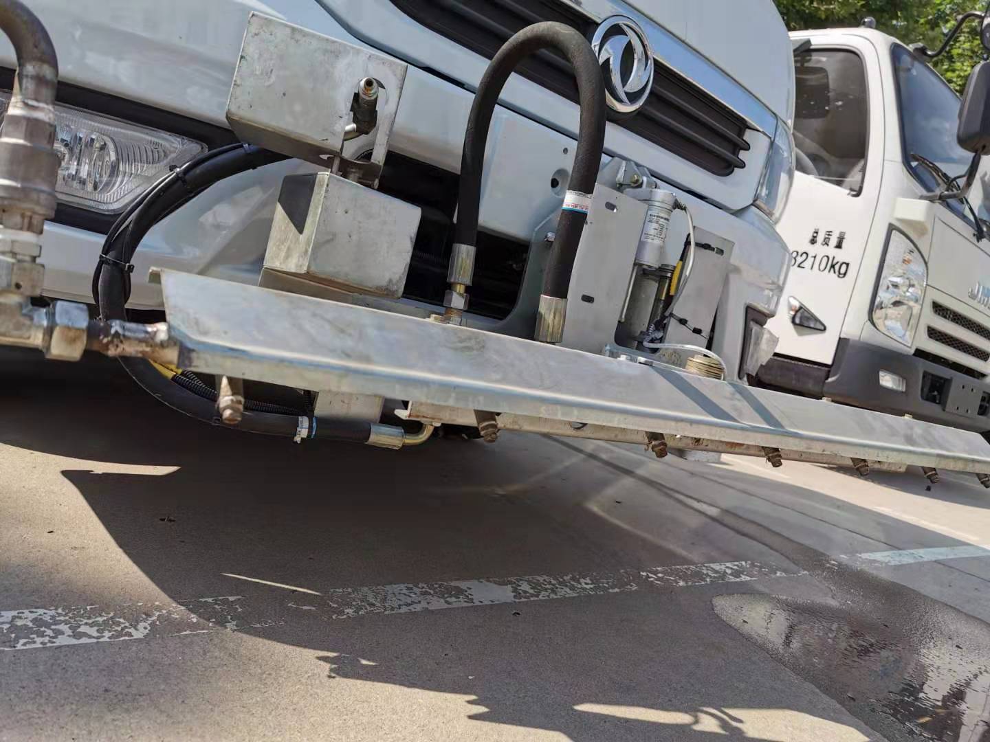 The Cleaning Of Pavement And Flyer Road Maintenance Vehicle