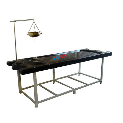 Brown Massage Table With Shirodhara Arrangement