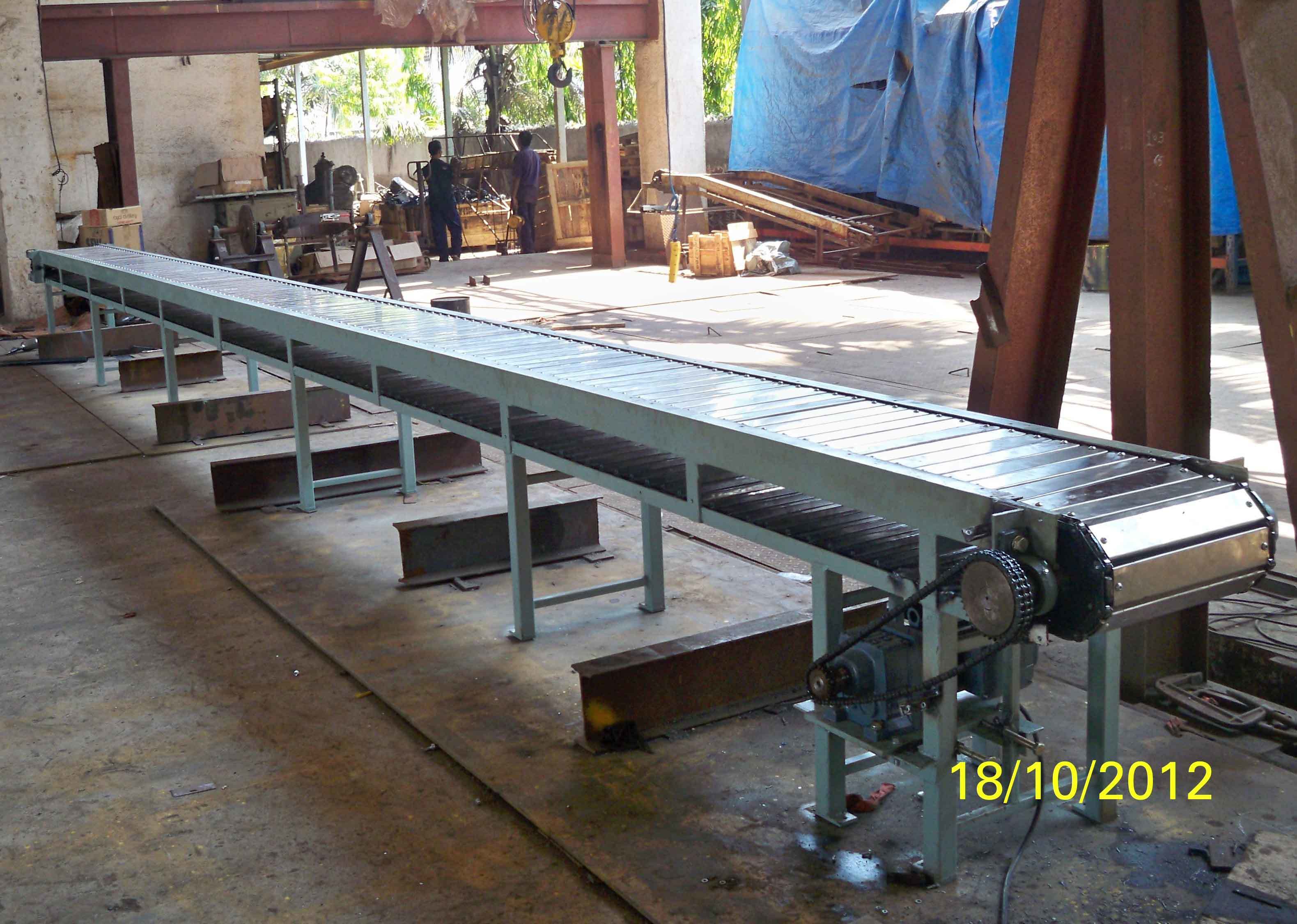 Slat Conveyor - Heavy Duty Ms & Ss Material, Customized Sizes & Lengths, Load Capacity Up To 1000 Kg, Easy To Install , Longer Production Life