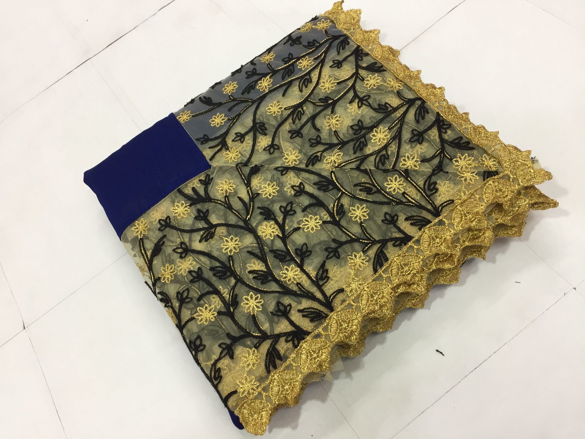 Party Wear Floral Heavy Embroidered Georgette And Net Saree In Blue And Black