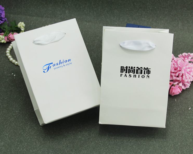 White Paper Bag - Paper, Variable Size, Off-white, Ribbon Handles | Durable, Stylish, Eco-friendly, Customizable, Lightweight