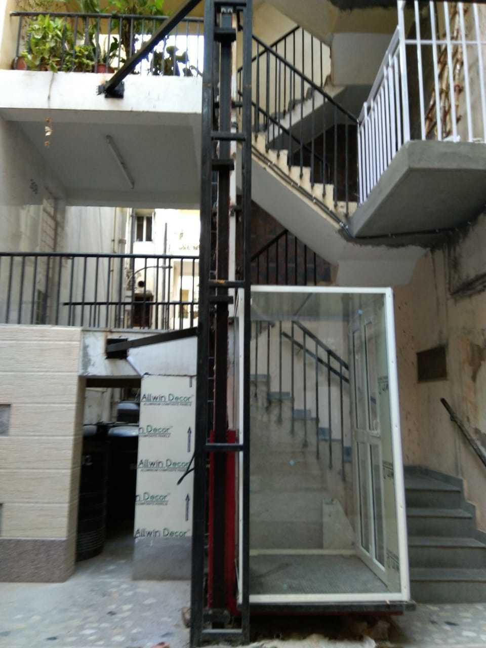 Goods Lifts - Mild Steel Body, Electric Power Source, Red Color | High Lifting Capacity, Designed For Industrial Use, 1-year Warranty
