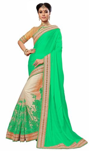 ग्रीन फ्लोरल डिज़ाइन साटन और नेट मिरर एम्ब्रायडरी वर्क साड़ी