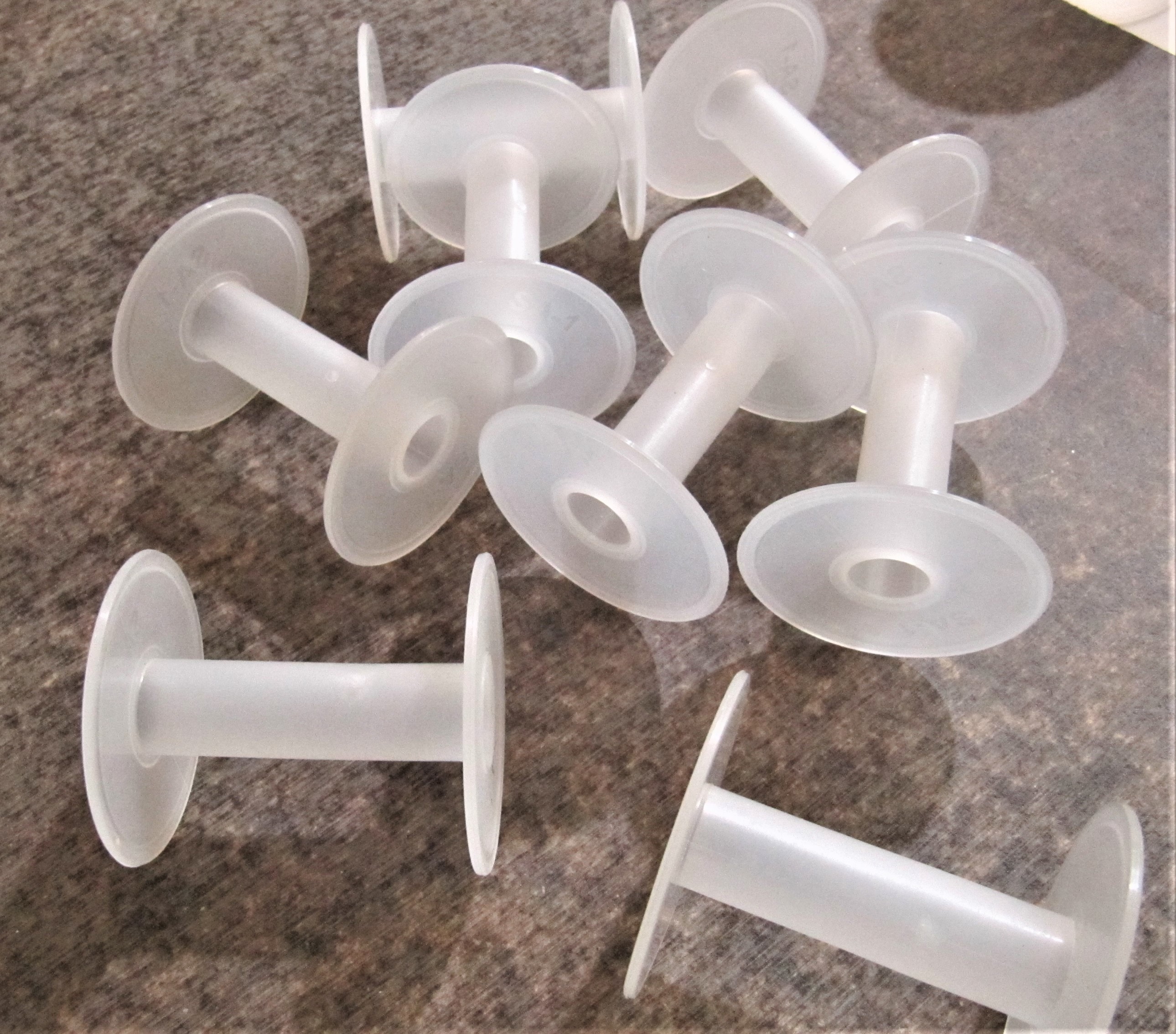 White Plastic Spools - 2.5 Inch Cylindrical Design | First Quality Plastic For Chains, Wires, Tapes, And Threads