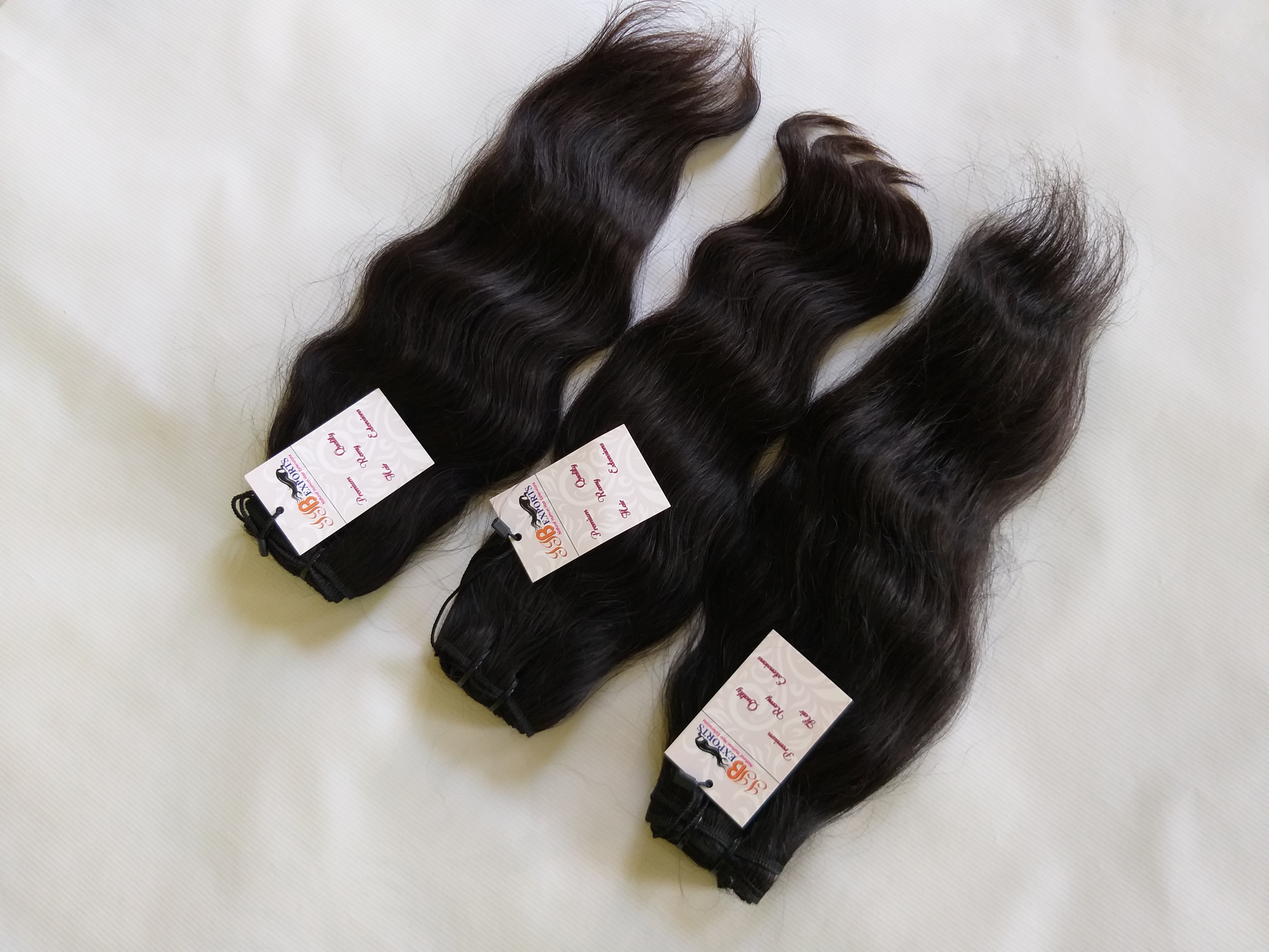 Indian Raw Unprocessed Top Quality Cuticle Aligned Wavy Human Virgin Hair - Color: Natural Black
