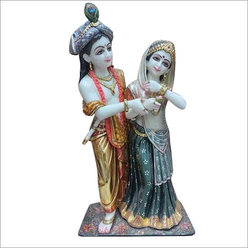 Polishing Radhe Krishna Raas Leela Statue