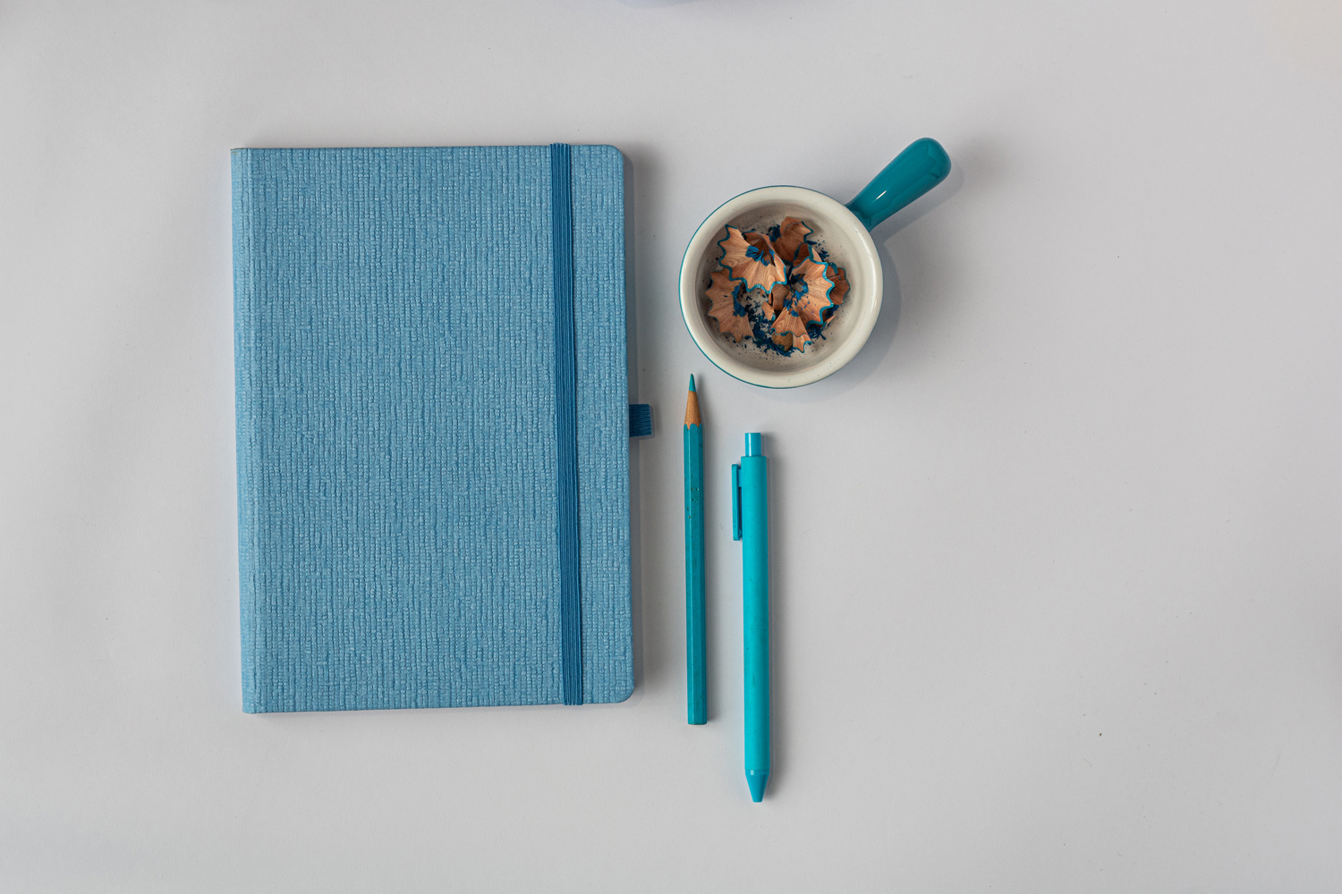 Features Include An Elastic Band Closure Comma Abaca - A5 Size - Hard Bound Notebook (Sky Blue)