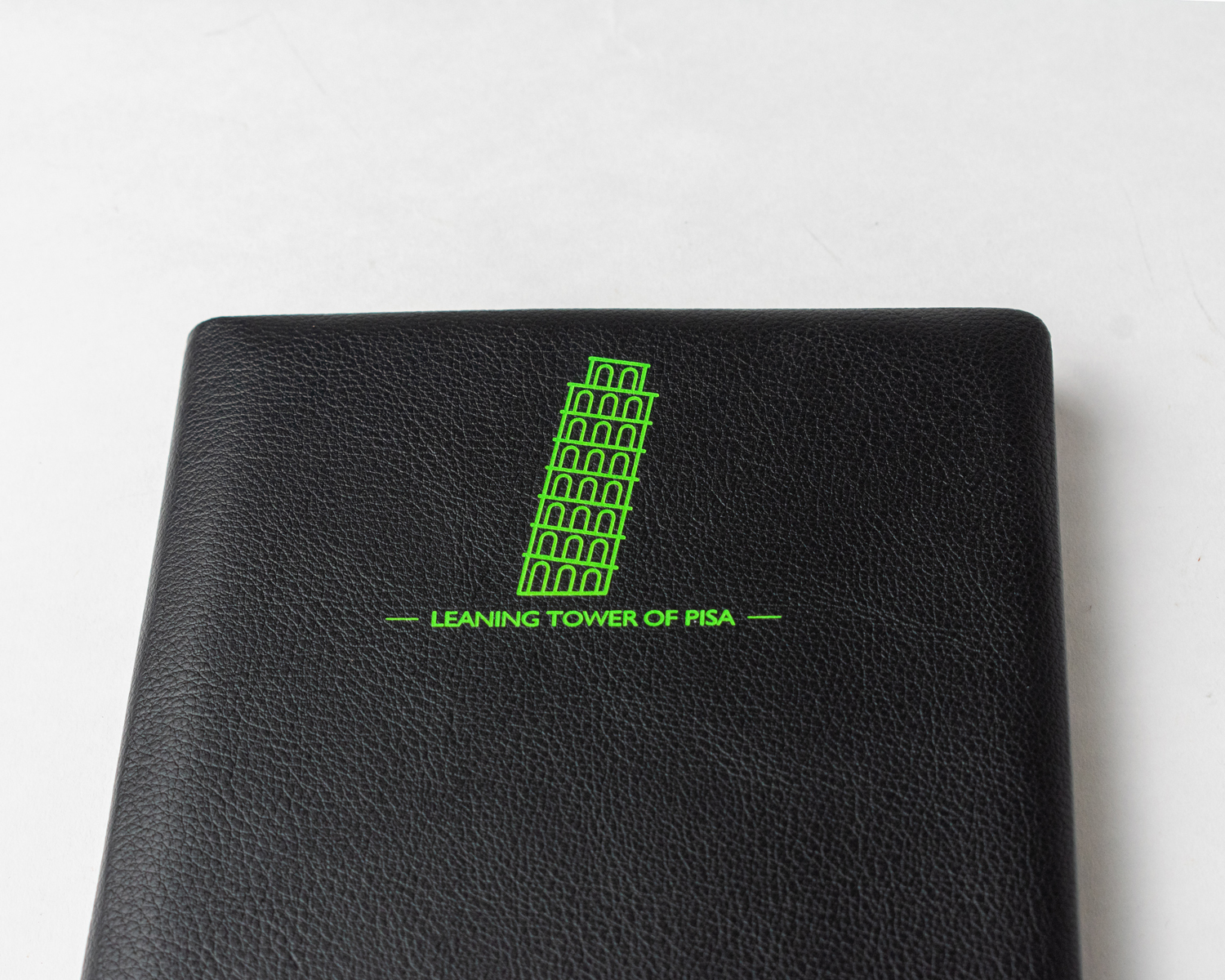 Comma Laser - A5 Hard Bound Notebook | 224 Pages, 80gsm Acid-free Paper, Green Laser Etched Leaning Tower Of Pisa Design, Integrated Satin Ribbon Bookmark, Rounded Spine And Corners, Stylish Un-ruled Green Pages