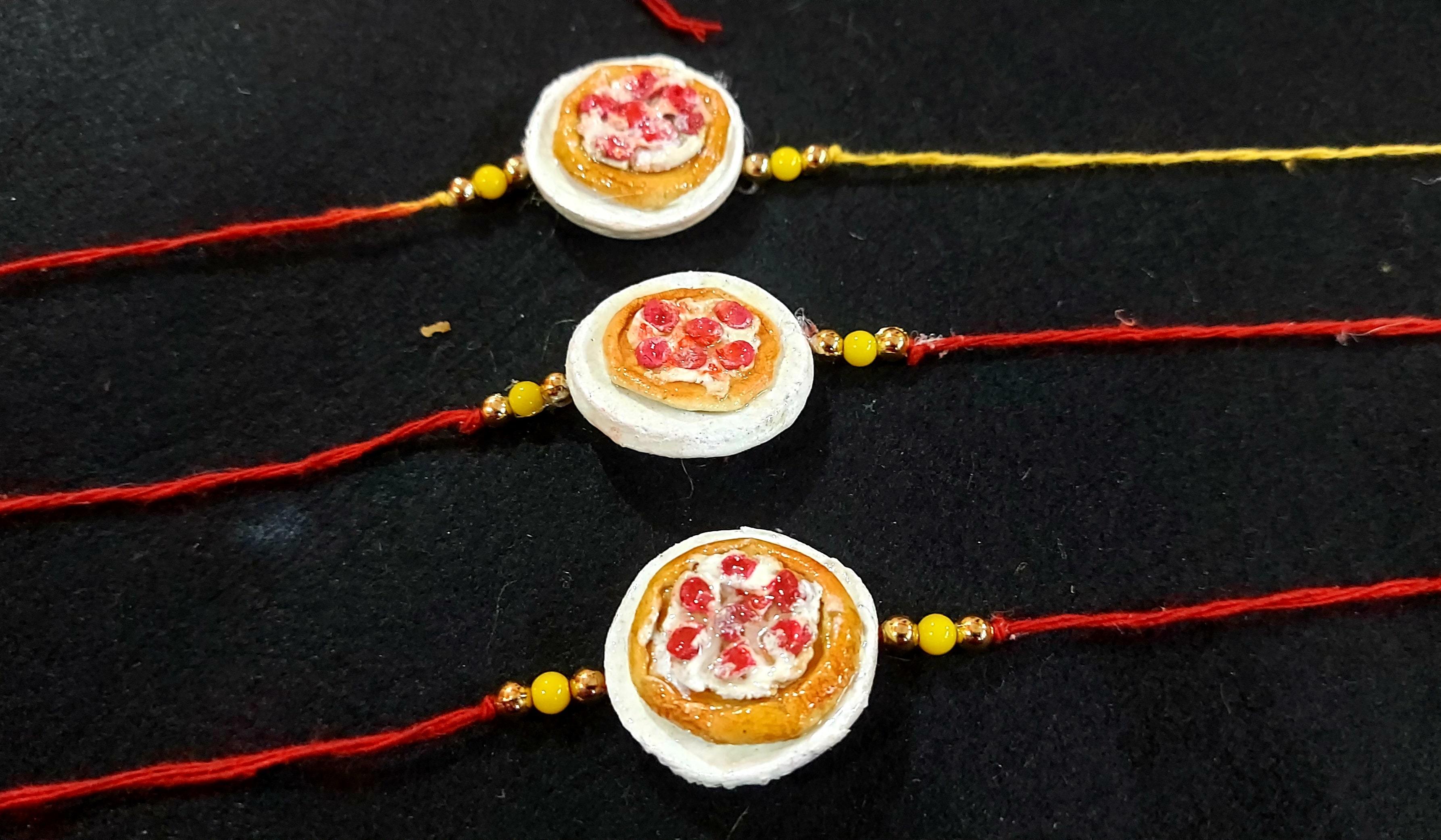 Designer Rakhies - Gold, 2x3 Inches, Red | Handmade Resin Rakhi, Elegant Design, Pearl Accents, Gift Box Packaging, Durable