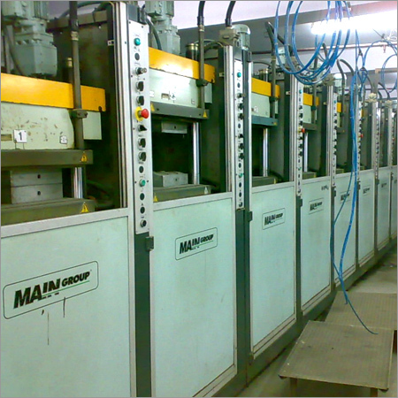 White & Green Shoe Making Machine