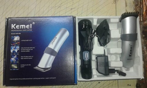 Kemei Hair Trimmer (KM 609) - Plastic Material, Rechargeable Battery, 8hrs Charging Time, 60mins Running Time - Detachable Settings, Handy Charging Stand, Cleaning Tool Inside