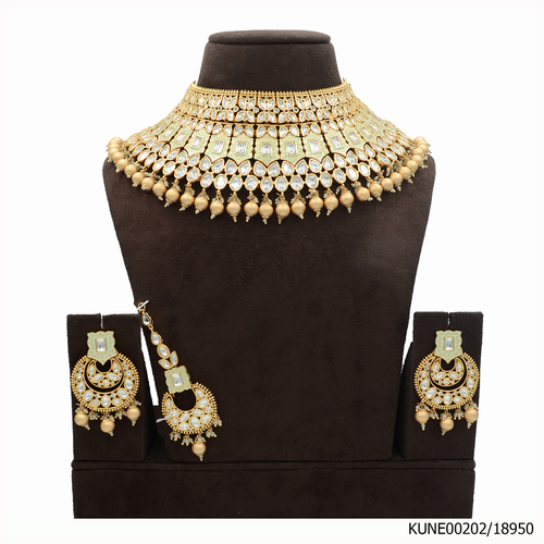 Kundan Semi Bridal Necklace Set With Maang Tikka And Mint Green Meena Kari Work
