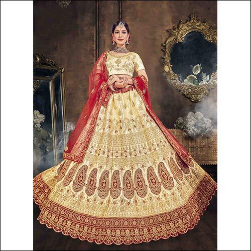 Cream & Red Heavy Multi Zari Embroidery And Daimond Fancy Border In Silk Fabric Lehenga With Velvet Patch And Silk Blouse And Net Embroidered Dupatta