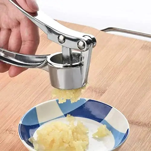 Silver Hand Held Garlic Crusher