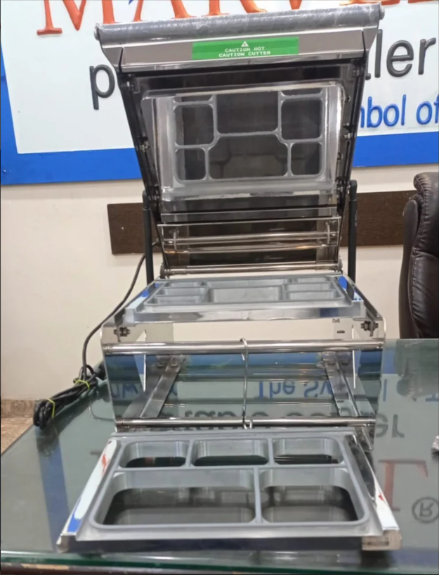 सिल्वर 8 पोर्शन मील ट्रे सीलिंग मशीन