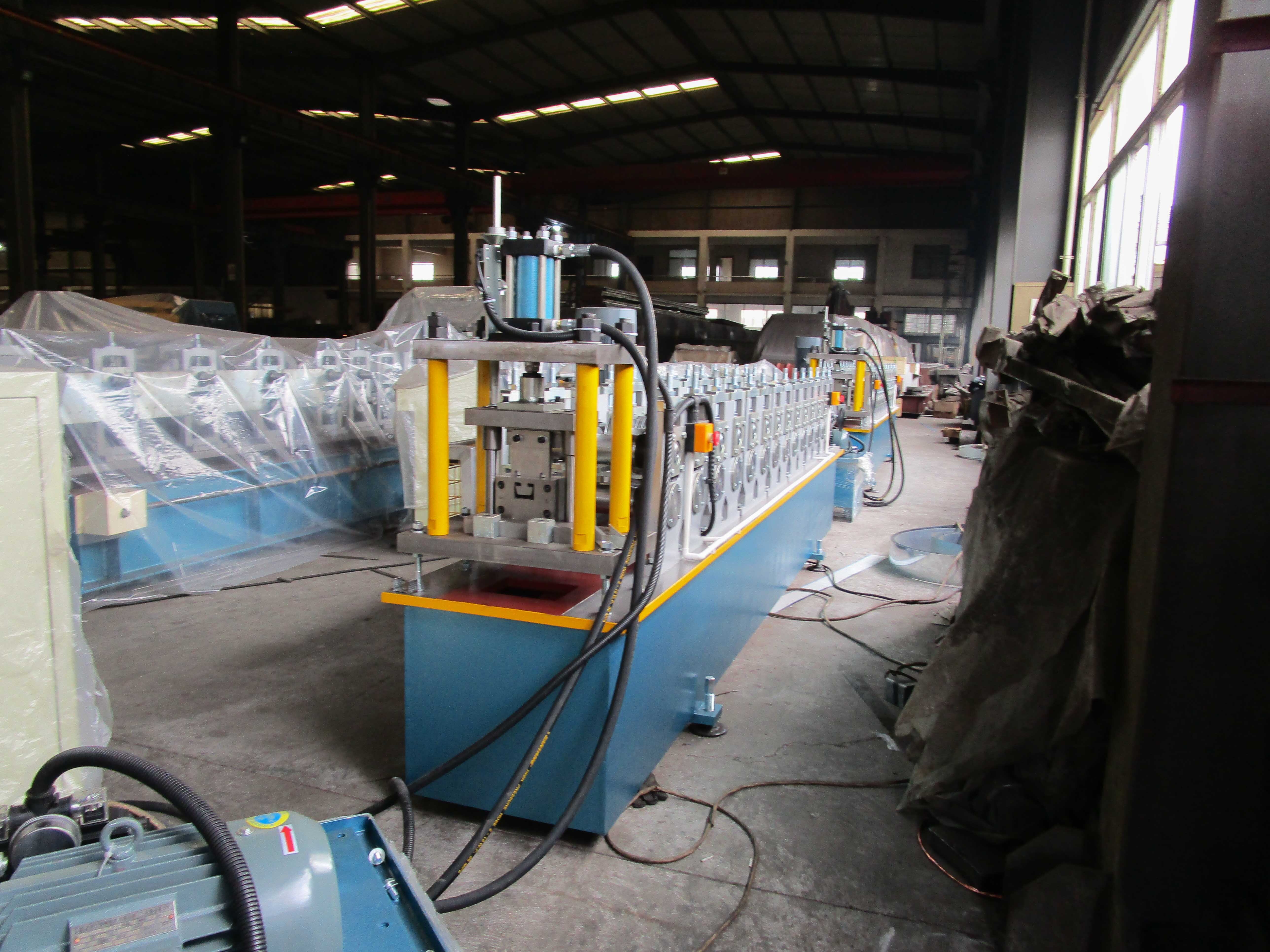 C U Stud & Track Roll Forming Machine - Steel Coil Sheet Material, 4.8x1.1x1.6 M Dimensions, Blue Color, 5.5 Kw Main Motor Power, 15 Forming Stations, Length-set Hydraulic Cutting System, 3-year Warranty