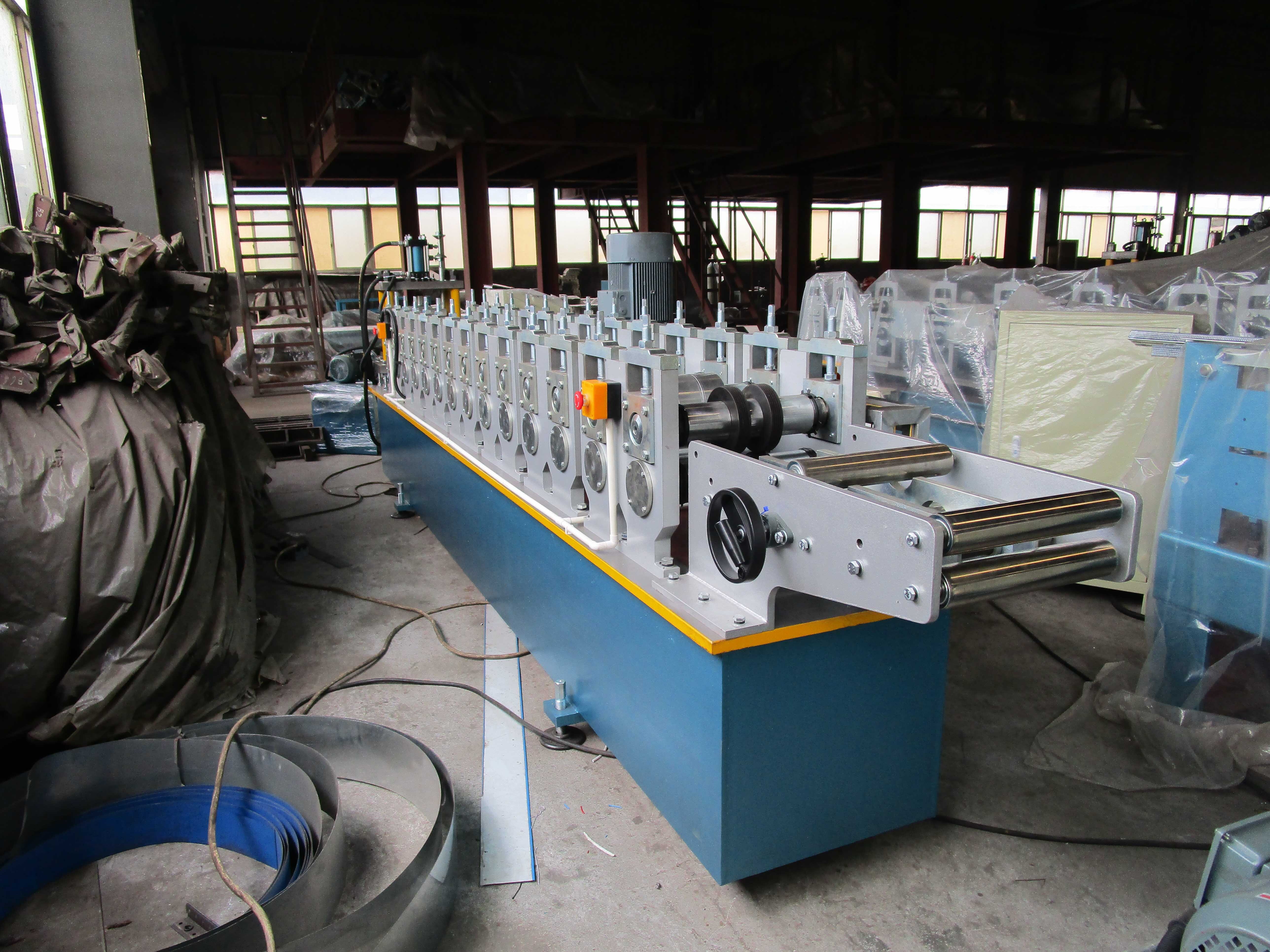 C U Stud & Track Roll Forming Machine - Steel Coil Sheet Material, 4.8x1.1x1.6 M Dimensions, Blue Color, 5.5 Kw Main Motor Power, 15 Forming Stations, Length-set Hydraulic Cutting System, 3-year Warranty
