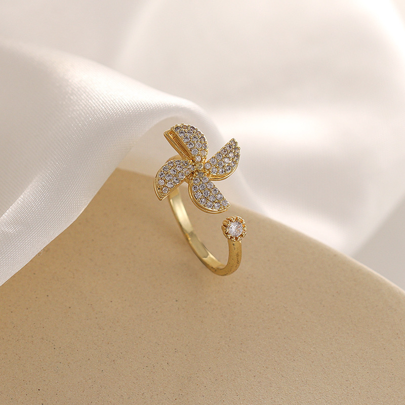 Rotating Cubic Zirconia Studded Adjustable Gold-plated Spinner Ring Gender: Women