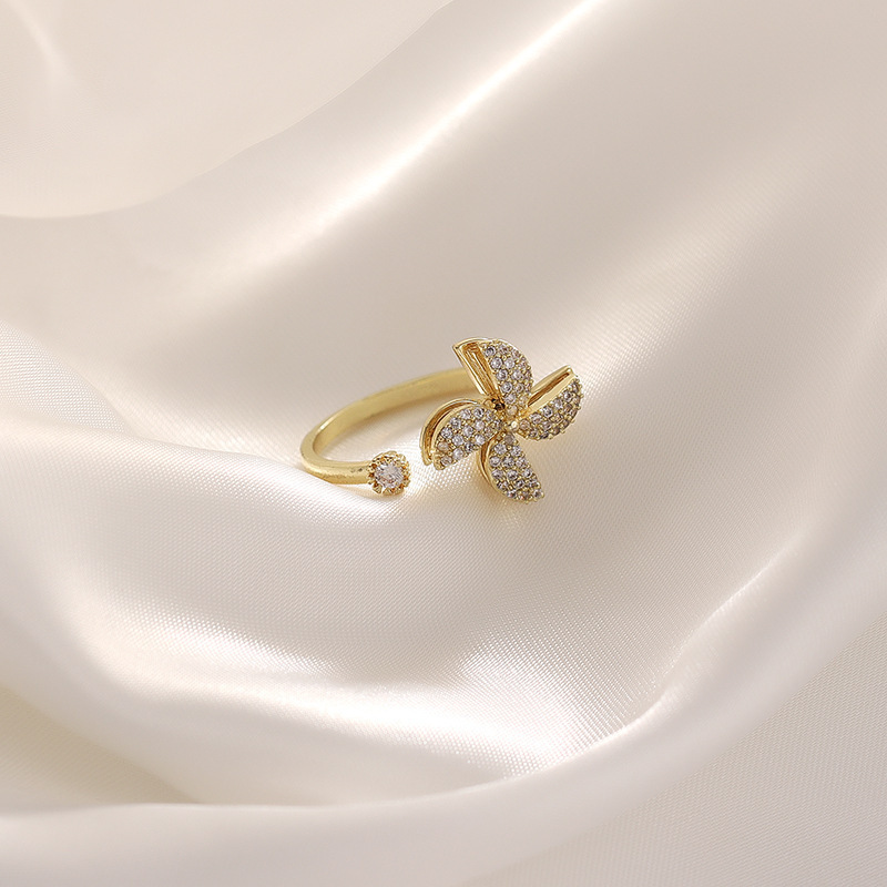Rotating Cubic Zirconia Studded Adjustable Gold-plated Spinner Ring Gender: Women