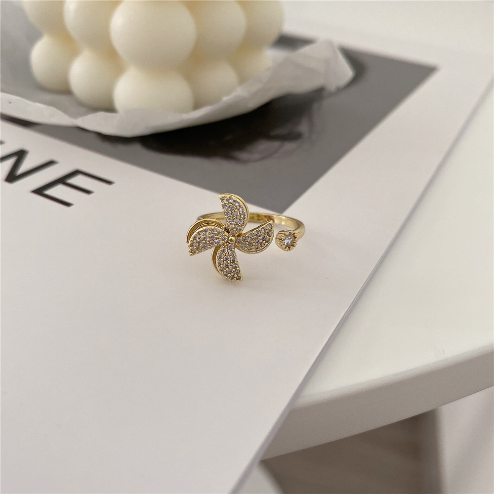 Rotating Cubic Zirconia Studded Adjustable Gold-plated Spinner Ring Gender: Women