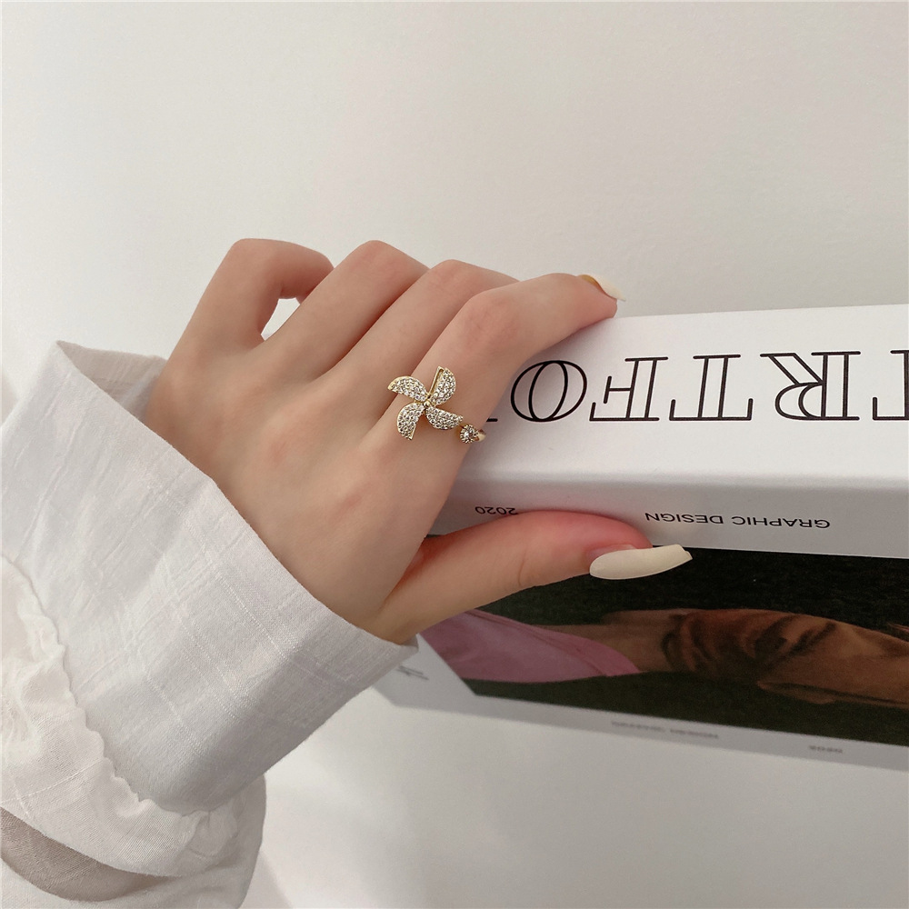 Rotating Cubic Zirconia Studded Adjustable Gold-plated Spinner Ring Gender: Women