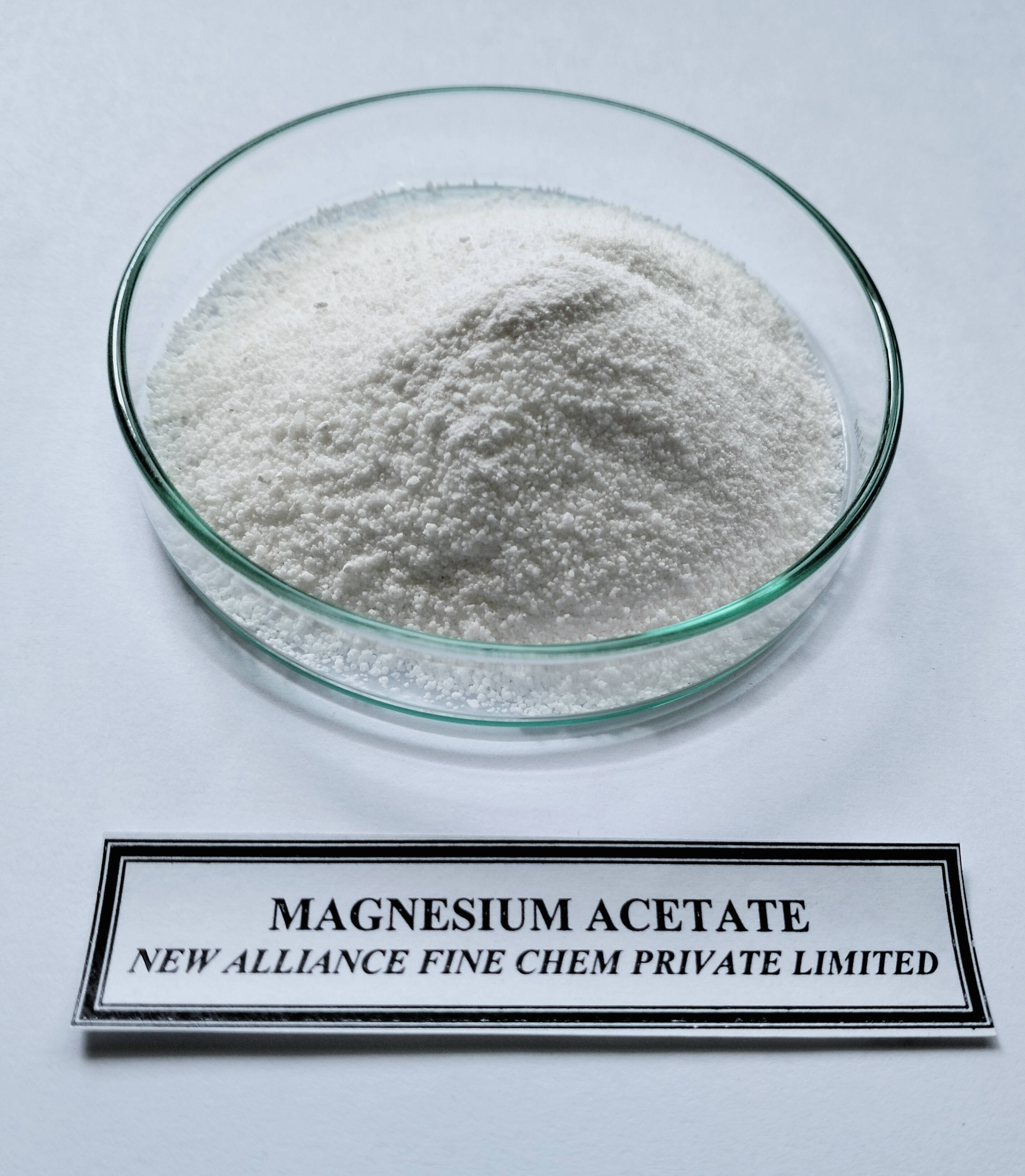 Magnesium Acetate - Ash %: 98.0 %.