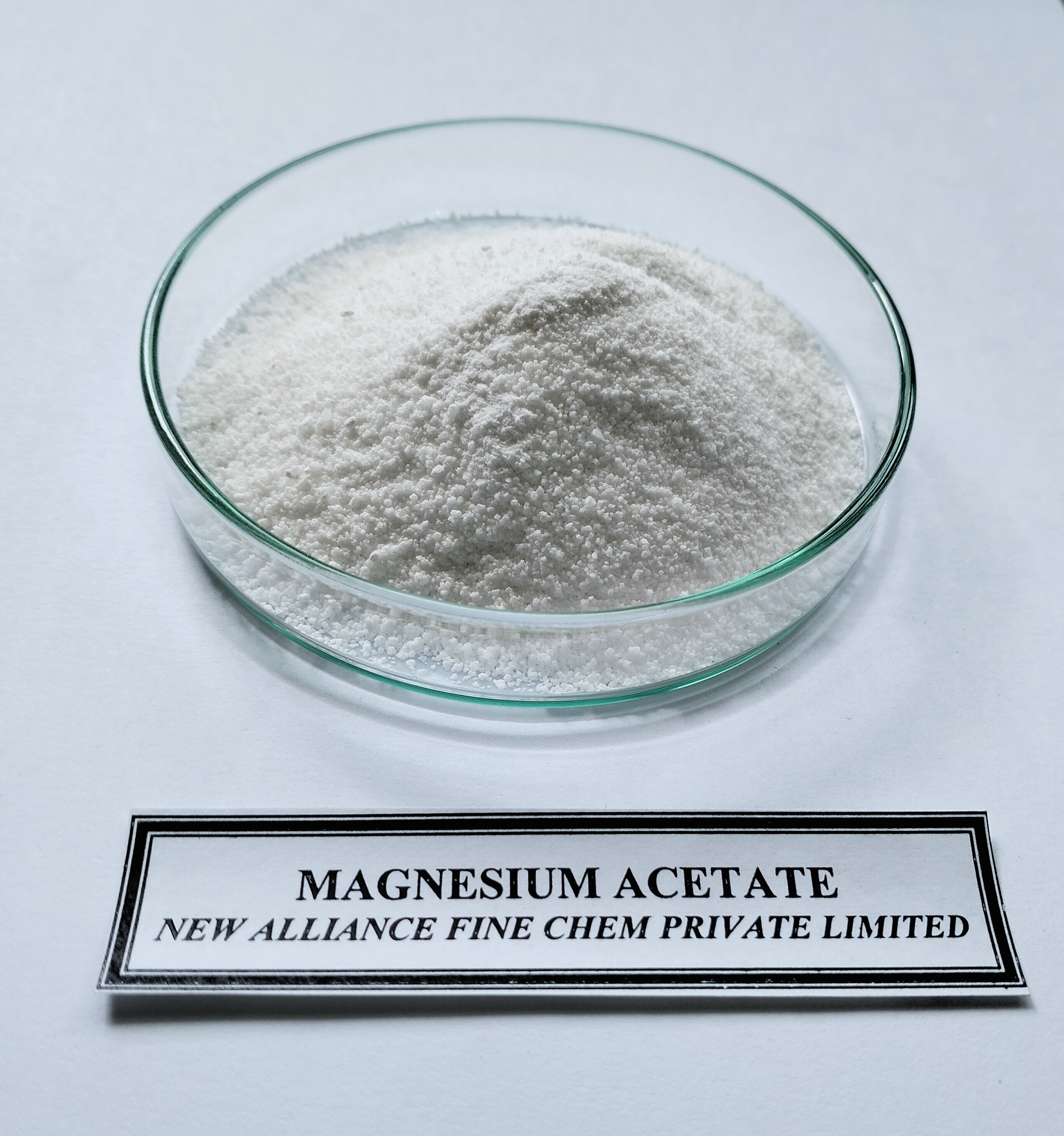 Magnesium Acetate - Ash %: 98.0 %.
