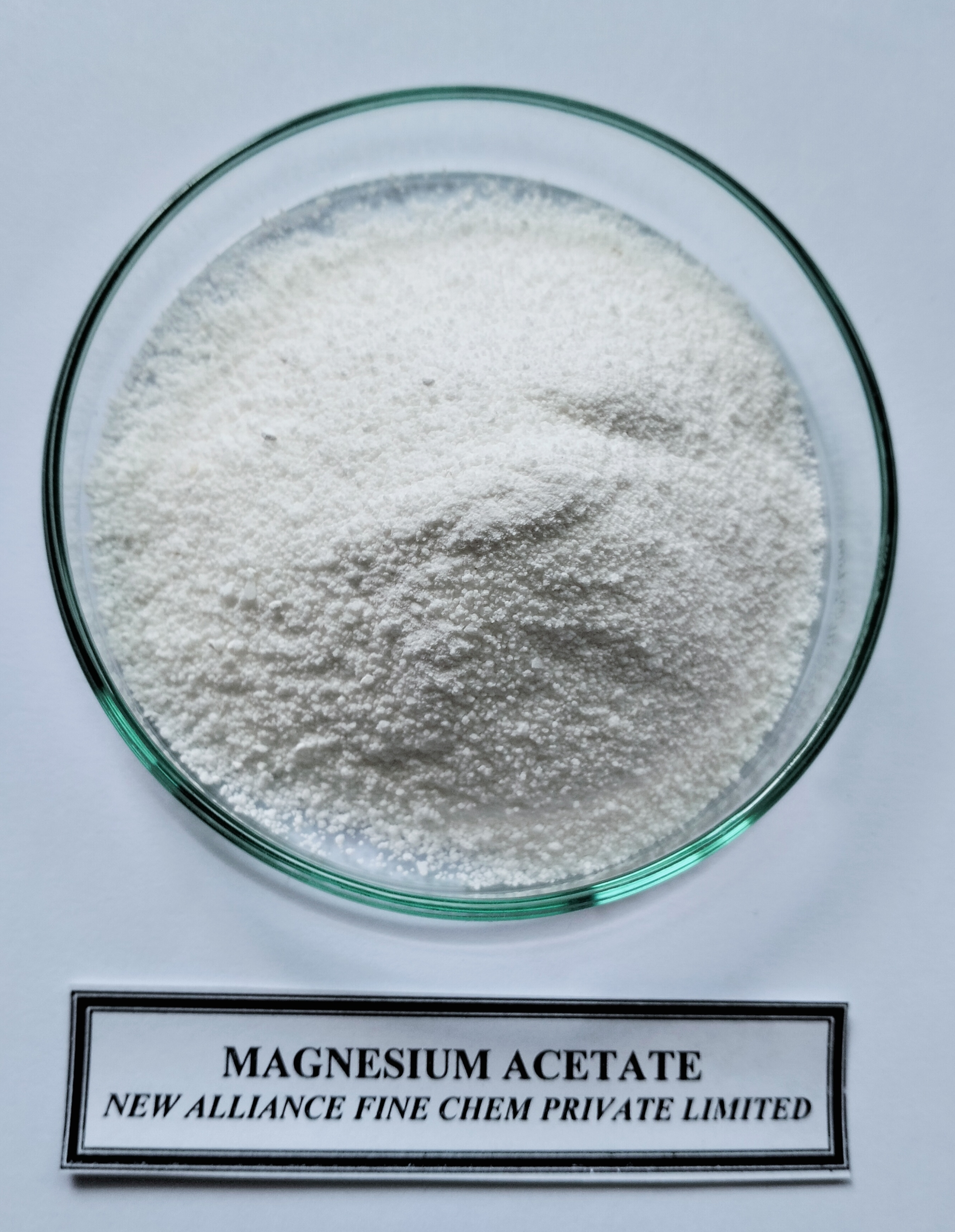 Magnesium Acetate - Ash %: 98.0 %.