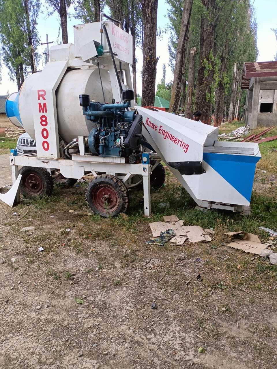 Reversible Concrete Mixer - 800kg Capacity, 12x6.5x11 Ft Dimensions, Customized Color, 10 Hp Motor, Plc Control, Hydraulic Oil Cooling, 10 Cum/hr Output, Pneumatic Wheels, 1.2 Meter Discharge Height