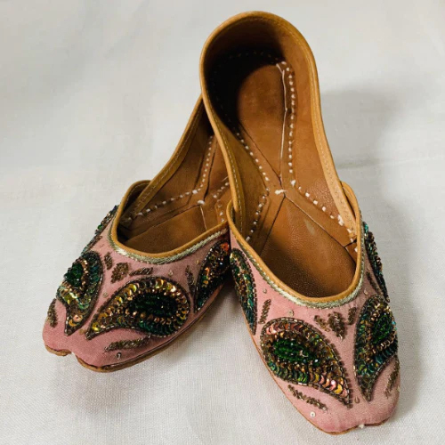 Sequin Punjabi Juttis - Leather Material, Customized Fit | Elegant Multi-beaded Mojari With Floral Pattern On Peach Base, Handcrafted By Skilled Artisans