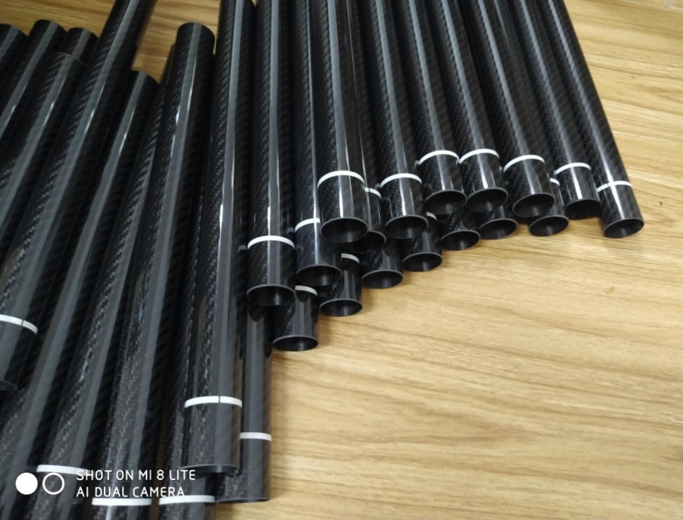 Black 30mm Diameter Roll Wrapped Carbon Fiber Tubing With White Warning Tape Provided By Chinese Factory