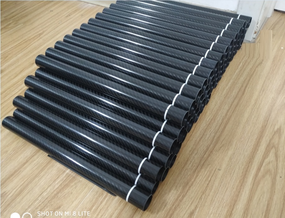 Black 30mm Diameter Roll Wrapped Carbon Fiber Tubing With White Warning Tape Provided By Chinese Factory