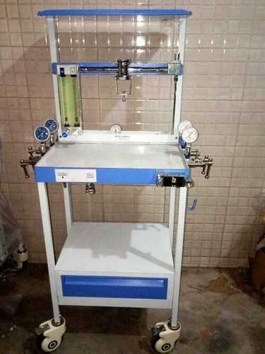 Anaesthesia Machine - Stainless Steel, Oxygen Flowmeter Range 100 cc/min. to 10 Litres/min., Nitrous Oxide Flowmeter Range 200 cc/min. to 12 Litres/min., Goldman Type Halothane Vaporizer, Emergency Flush Valve, Four Castor Trolley with Lockable Wheels, Non-return cum Pressure Relief Valve