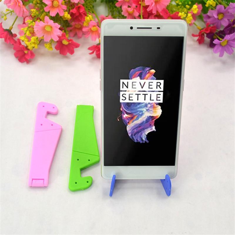Universal Phone Stand Foldable V Shape Mobile Mount Stand Holder Bracket (Random Color) (0288) - Plastic Construction , Multi/assorted Colors, Compact Design