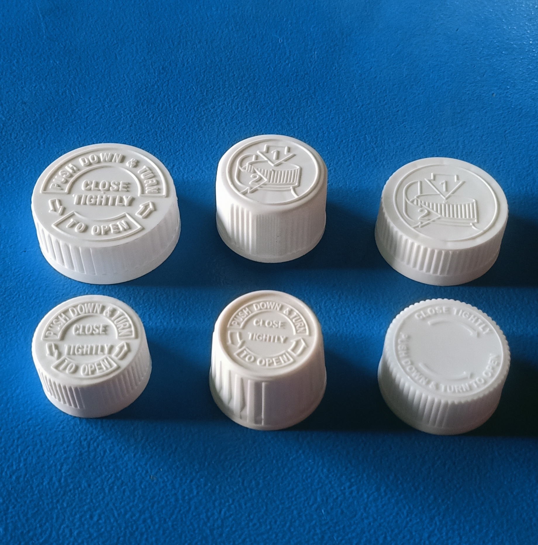 White 25 Mm Child Resistant Cap With Measuring Cup