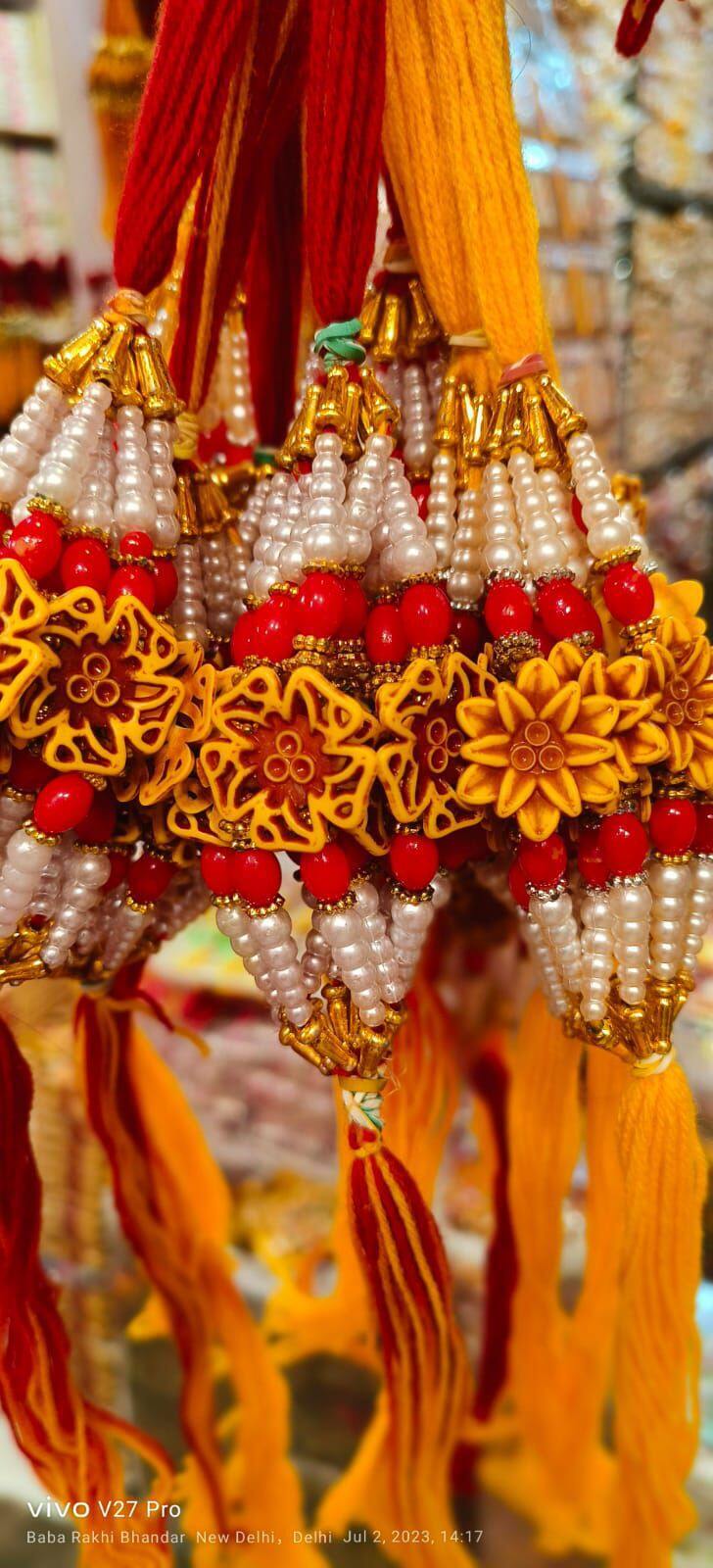 Fancy Rakhi New Modal - Beads And Thread, 20 Cm Length, Red Color , Auspicious Occasion, Elegant Design, Sibling Bonding With Traditional Motif