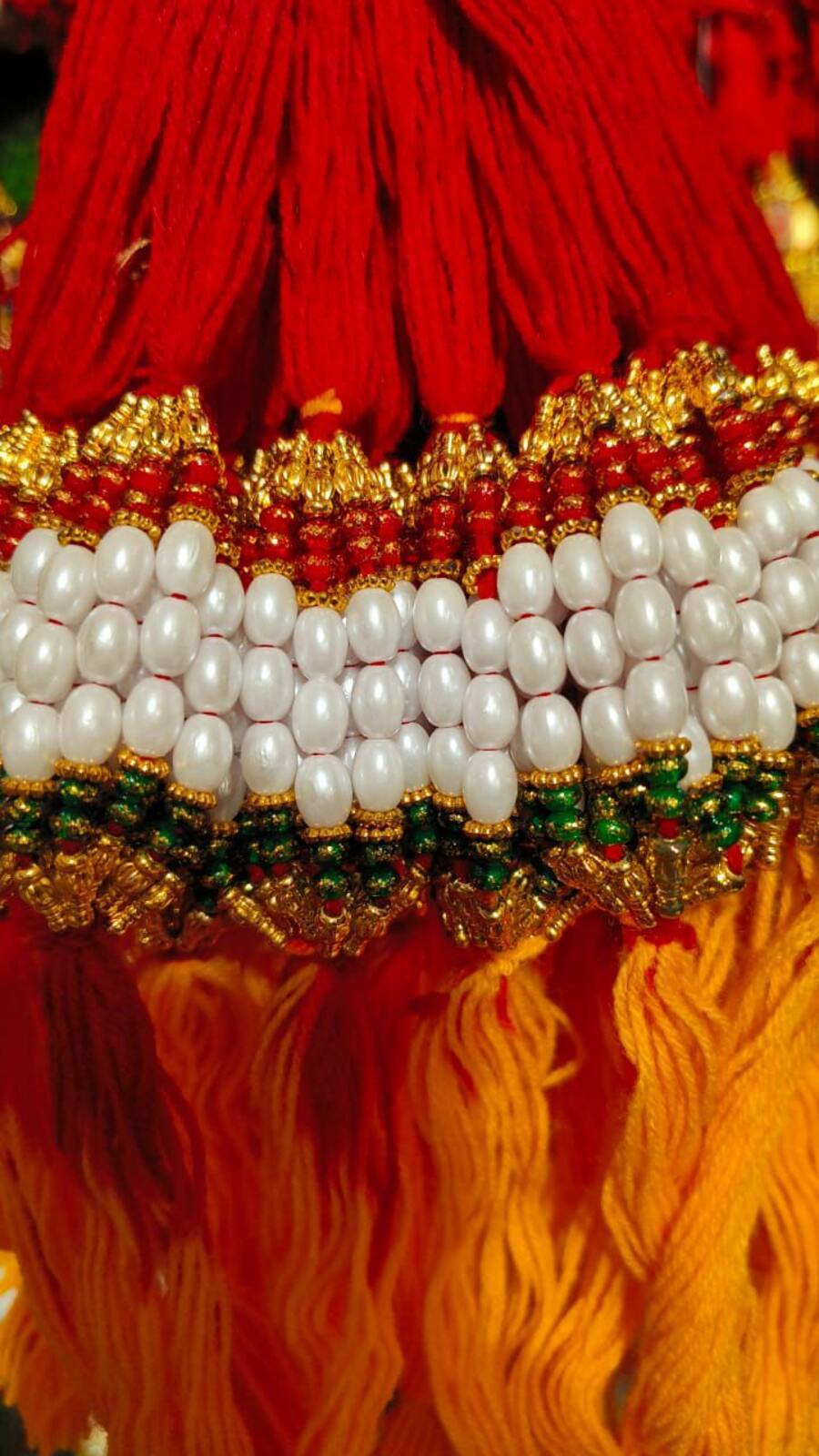 Fancy Rakhi New Modal - Beads And Thread, 20 Cm Length, Red Color , Auspicious Occasion, Elegant Design, Sibling Bonding With Traditional Motif