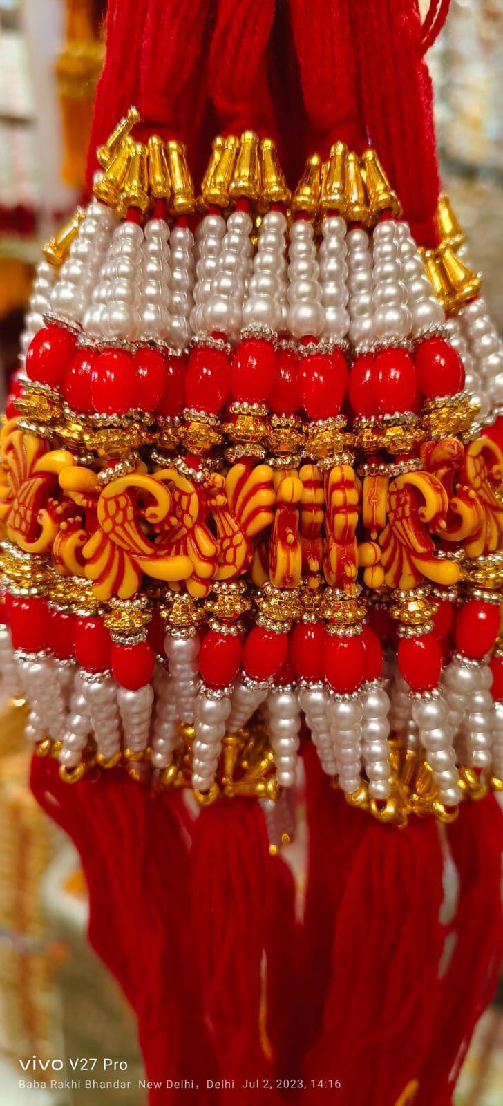Fancy Rakhi New Modal - Beads And Thread, 20 Cm Length, Red Color , Auspicious Occasion, Elegant Design, Sibling Bonding With Traditional Motif