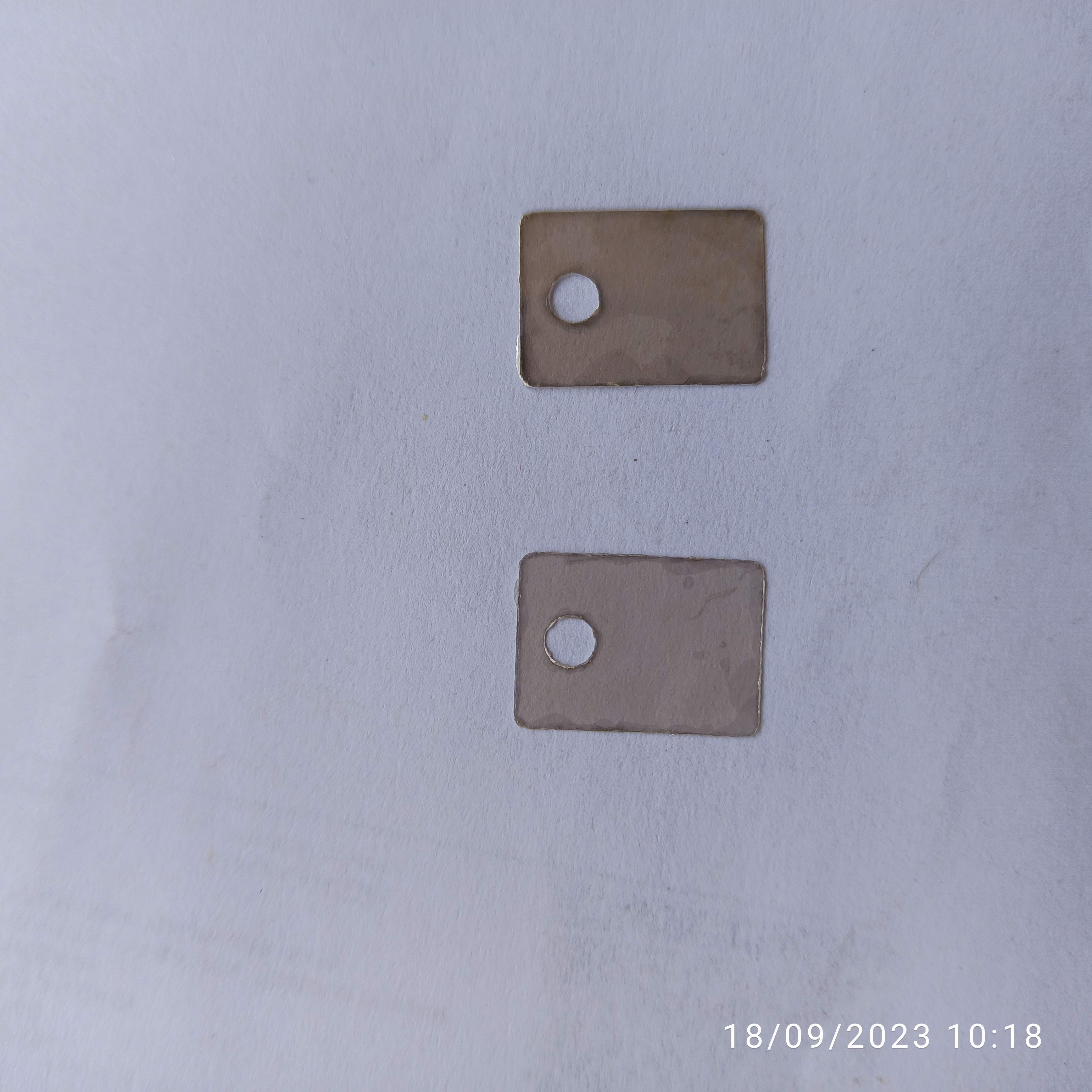 Mica For To220 13 X 18 Mm - Natural Sheet Mica, Grey Color, Standard Particle Size, Mica Spacers With Perforations For Electronic Tubes