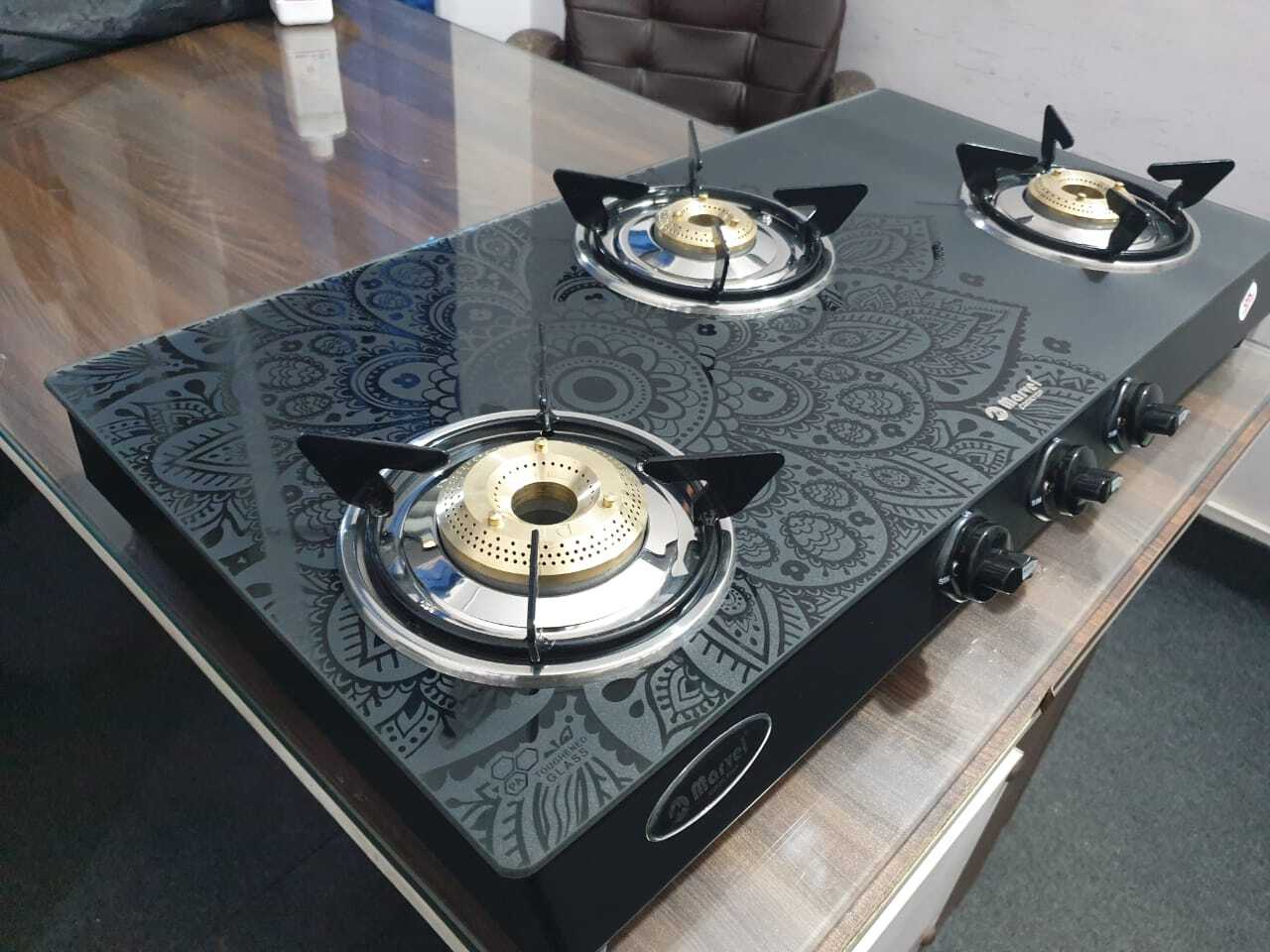 3br Designer (Mandala Black Glass With Ms Frame - Frost 3410) - Ms Toughened Black Glass, 3 Burner Lpg, Heavy Pan Support, Manual Ignition, Rotating Brass Nozzle, Metallic Knob