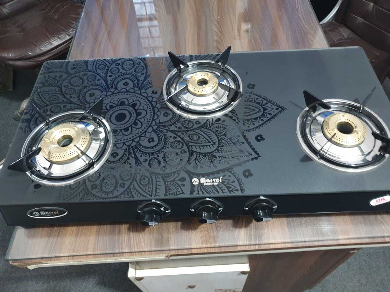 3br Designer (Mandala Black Glass With Ms Frame - Frost 3410) - Ms Toughened Black Glass, 3 Burner Lpg, Heavy Pan Support, Manual Ignition, Rotating Brass Nozzle, Metallic Knob