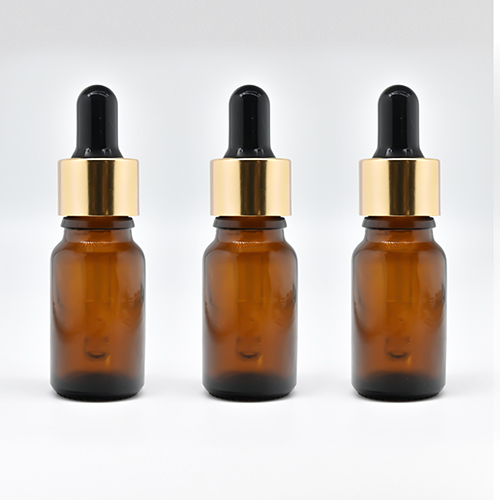 Gold Sleeve Glass Dropper Bottle With Black Teat - Color: As Per Requirement