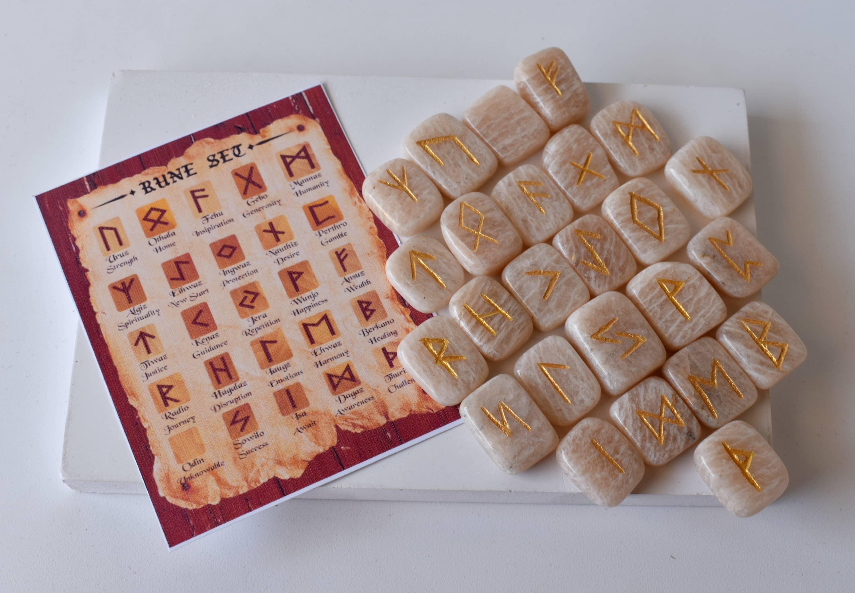 Moonstone Rune Set - Hand-carved Natural Moonstone Gemstones, 25 Unique Futhark Symbols, Includes Pouch & Guidebook, Optional Wooden Grid Plate