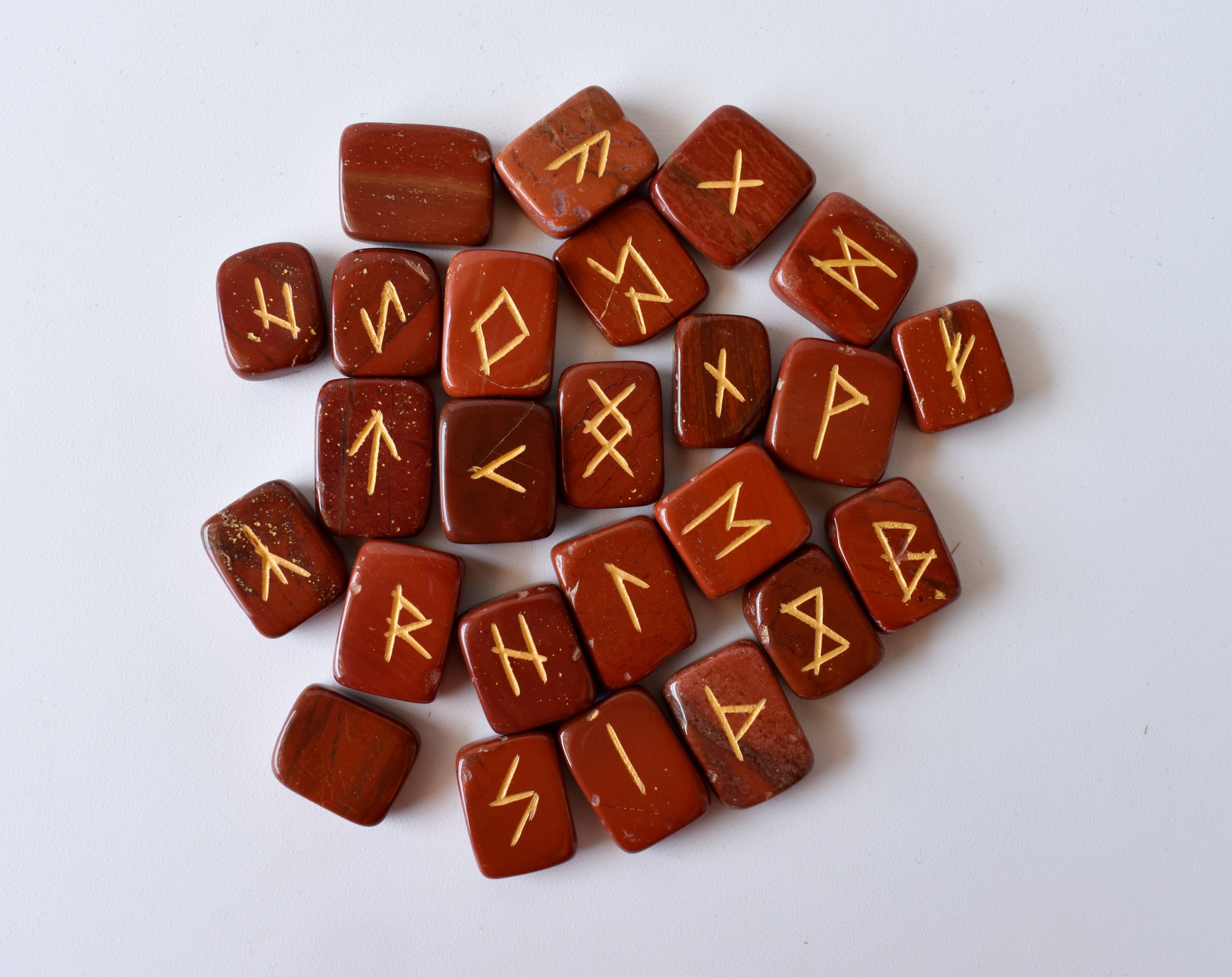 Red Jasper Rune Set - 25 Hand-carved Natural Gemstones, Unique Futhark Symbols, Includes Pouch, Info Cards & Optional 6" Wooden Grid Plate