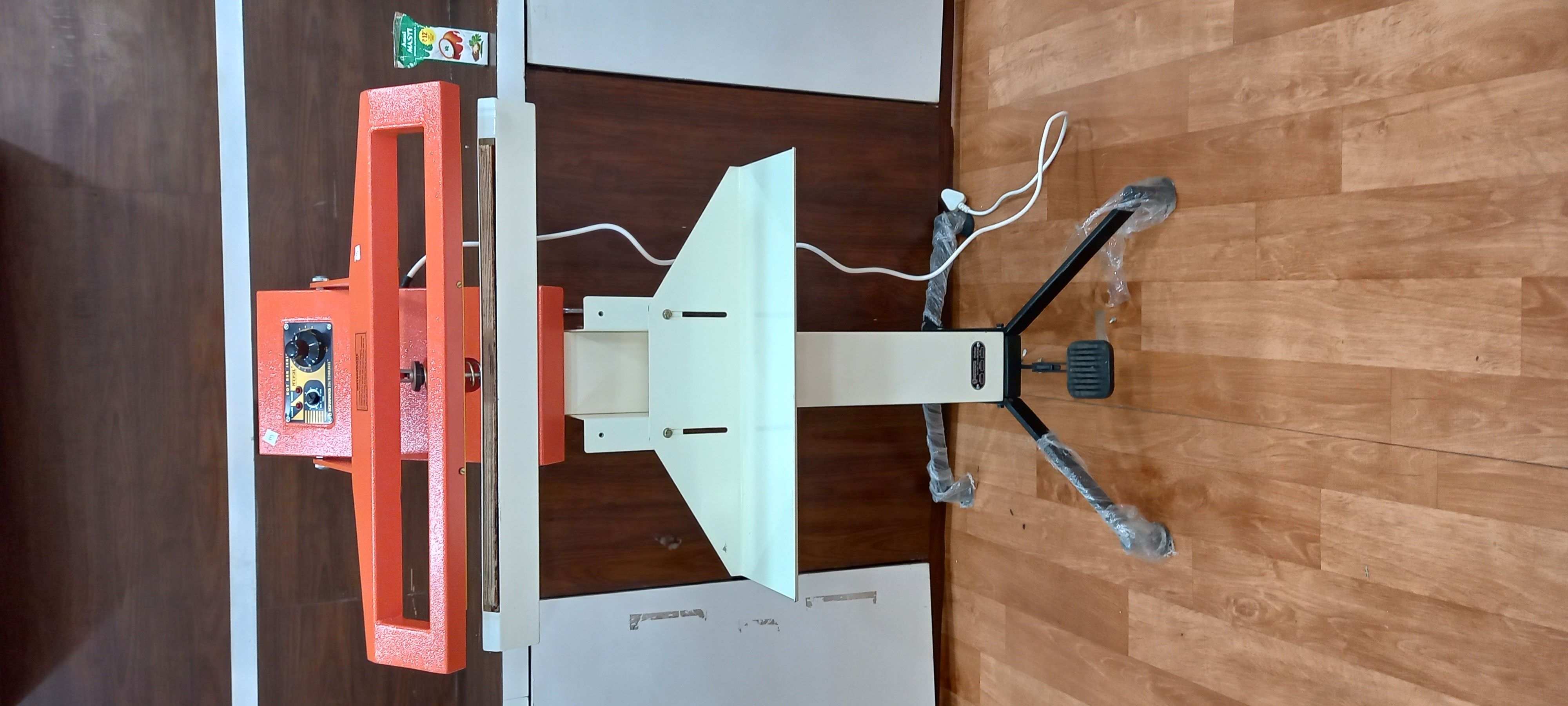 Orange Pedal Sealer Machine